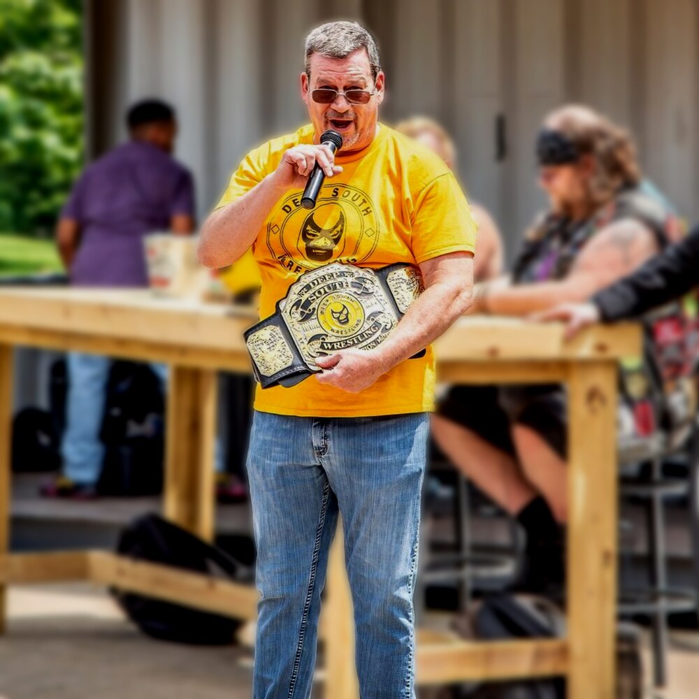 Nick Patrick today, holding the Deep South Wrestling championship belt